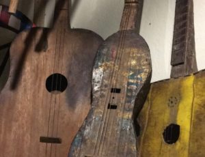 Handmade wooden guitars, on the left from Livingstone, in the middle from Angola and on the right from Central Zambia